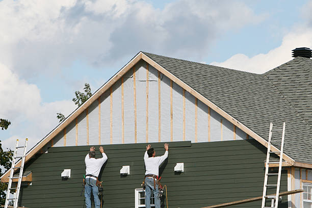 Professional Siding technician working in Reading, MA
